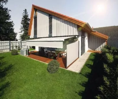 Markisen Jesteburg - Einfamilienhaus mit einer Gelenkarmmarkise und farblich passender Seitenmarkise
